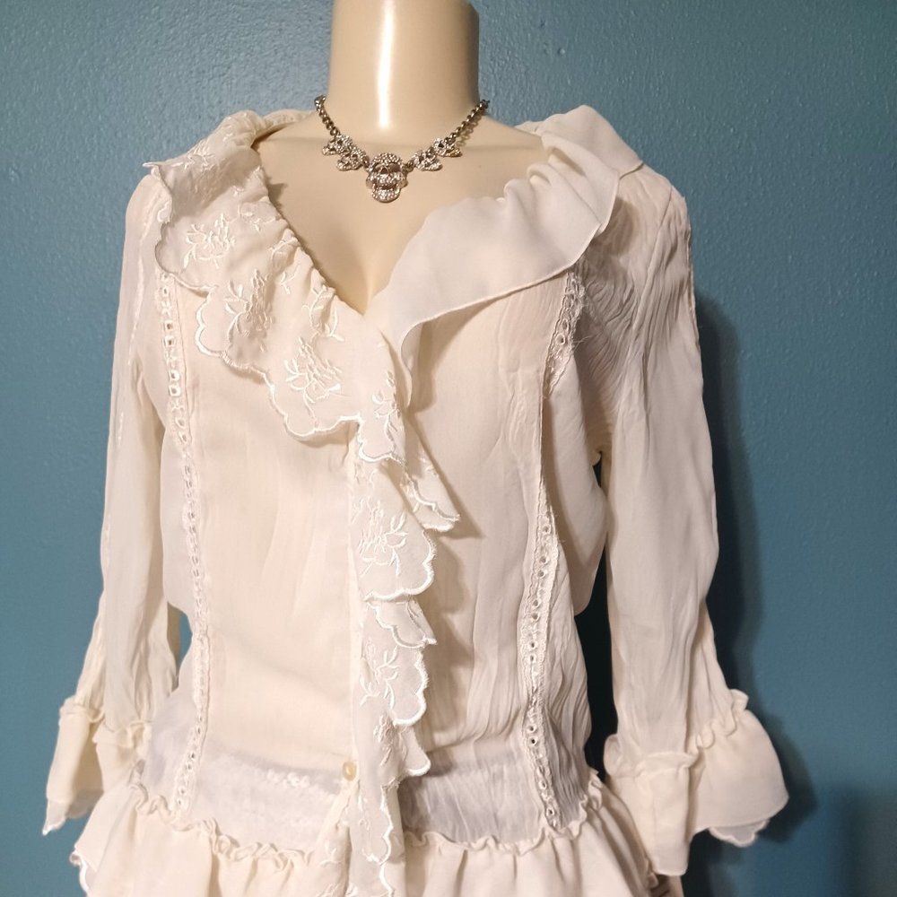 White ruffle blouse